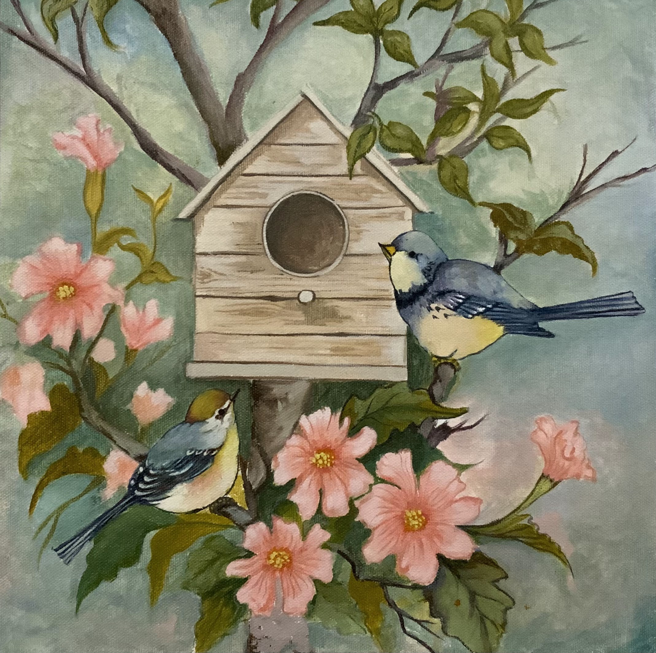 Two small birds among pink flowers beside a wooden birdhouse.