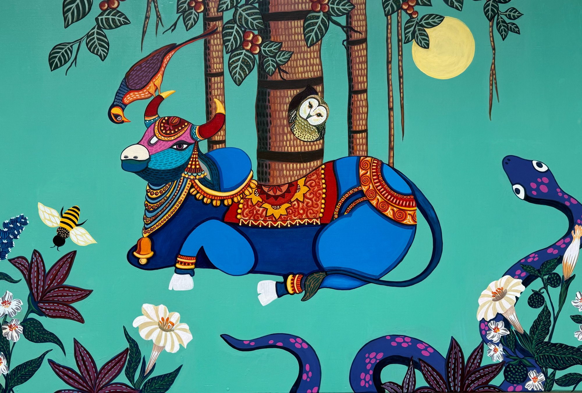 Blue Nandi resting beneath trees, surrounded by flowers, snakes, birds and a crescent moon.