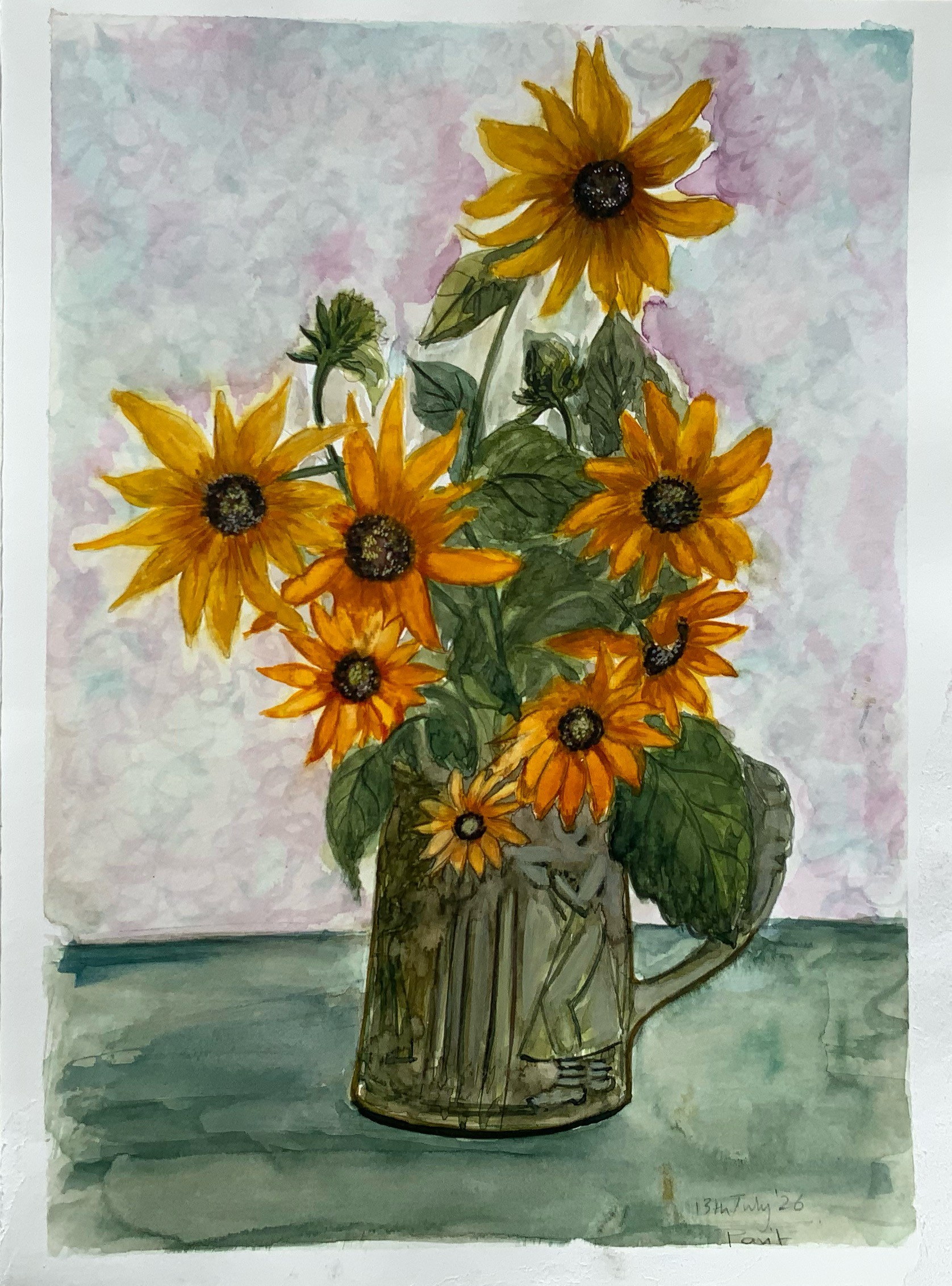 Loose yellow sunflowers arranged in a glass jar on a softly washed ground.